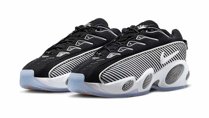 Side view of Drake's black and white Nike sneakers.